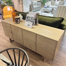Showroom Clearance: Cadoc Smoked Oak 4 Door Sideboard Showroom Clearance: Cadoc Smoked Oak 4 Door Sideboard