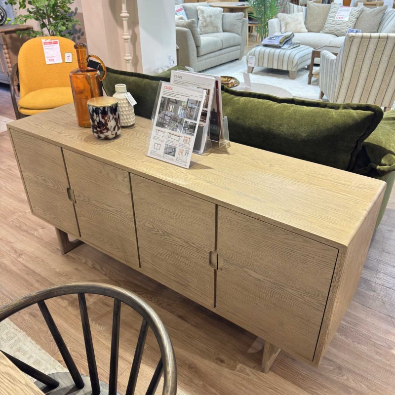 Showroom Clearance: Cadoc Smoked Oak 4 Door Sideboard Showroom Clearance: Cadoc Smoked Oak 4 Door Sideboard